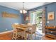 Eat-in kitchen and dining room features modern lighting and outdoor access at 1413 Lily Creek Dr, Cary, NC 27518