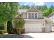 Charming two-story home with a three car garage and manicured landscaping at 1413 Lily Creek Dr, Cary, NC 27518