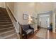 Welcoming foyer featuring hardwood floors, staircase, and decorative furnishings at 1413 Lily Creek Dr, Cary, NC 27518