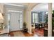 Spacious foyer with hardwood floors, arched doorways and natural lighting at 1413 Lily Creek Dr, Cary, NC 27518