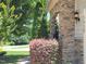 Stone accented home featuring lush green landscaping and manicured bushes at 1413 Lily Creek Dr, Cary, NC 27518