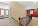 Second floor hallway with staircase, carpet, and open doorway at 1413 Lily Creek Dr, Cary, NC 27518