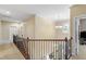 Second floor hallway with chandelier lighting and a staircase at 1413 Lily Creek Dr, Cary, NC 27518
