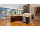Kitchen area with stainless steel appliances, granite countertops, and dark wood cabinetry at 1413 Lily Creek Dr, Cary, NC 27518