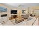 Inviting living room features fireplace, large windows, and comfortable seating at 1413 Lily Creek Dr, Cary, NC 27518
