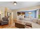 Open concept living room and dining area with hardwood floors and ample natural light at 1413 Lily Creek Dr, Cary, NC 27518