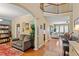 Open floorplan with hardwood floors connecting the living room and dining area at 1413 Lily Creek Dr, Cary, NC 27518
