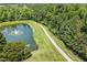A small pond with a fountain feature and a path next to the pond at 1413 Lily Creek Dr, Cary, NC 27518