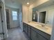 The primary bathroom features a dual sink vanity, a large mirror, and a glass shower at 154 N Finley Landing Pkwy, Smithfield, NC 27577