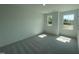 This bedroom is bright with natural light from the two windows and features gray carpet at 154 N Finley Landing Pkwy, Smithfield, NC 27577
