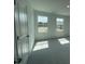 Comfortable bedroom with soft carpeting and bright windows, offering a serene and inviting space at 154 N Finley Landing Pkwy, Smithfield, NC 27577