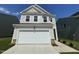 Charming two-story home with a two-car garage and manicured landscaping, perfect for suburban living at 154 N Finley Landing Pkwy, Smithfield, NC 27577