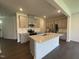 Modern kitchen with a large island, stainless steel appliances, and gray cabinetry, ideal for cooking and entertaining at 154 N Finley Landing Pkwy, Smithfield, NC 27577