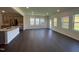 Open concept living area with hardwood floors and large windows that flood the space with natural light at 154 N Finley Landing Pkwy, Smithfield, NC 27577