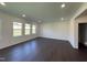 Spacious living room with hardwood floors, recessed lighting, and large windows, providing a bright and welcoming atmosphere at 154 N Finley Landing Pkwy, Smithfield, NC 27577