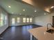 Bright, open living room with hardwood floors and ample natural light, seamlessly connected to the kitchen at 154 N Finley Landing Pkwy, Smithfield, NC 27577