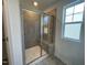 This modern glass shower includes a built-in bench at 154 N Finley Landing Pkwy, Smithfield, NC 27577