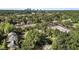 A high angle view of a home with mature trees and a distant view of the city skyline on the horizon at 1811 Ridley St, Raleigh, NC 27608