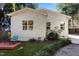 Back of the house with multiple windows and a view of the outdoor patio at 1811 Ridley St, Raleigh, NC 27608