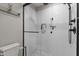 Modern bathroom with white subway tile shower, glass door, and sleek fixtures at 1811 Ridley St, Raleigh, NC 27608
