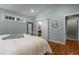 Spacious bedroom featuring a sliding barn door that leads to the ensuite bathroom at 1811 Ridley St, Raleigh, NC 27608