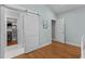 Bedroom view showing hardwood floors and entrance to a walk-in closet at 1811 Ridley St, Raleigh, NC 27608