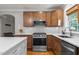 Modern kitchen with stainless steel appliances, granite countertops, and ample cabinet space at 1811 Ridley St, Raleigh, NC 27608