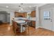 Well-appointed kitchen with wooden cabinets, stainless steel appliances, and a center island at 1811 Ridley St, Raleigh, NC 27608