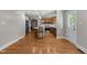 Spacious kitchen with a large island, stainless steel appliances, and hardwood floors at 1811 Ridley St, Raleigh, NC 27608