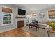 Bright living room featuring a fireplace, large sectional sofa, and stylish decor at 1811 Ridley St, Raleigh, NC 27608