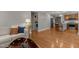Open-concept layout showcasing living room, laundry, and kitchen with hardwood floors at 1811 Ridley St, Raleigh, NC 27608