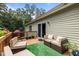 Cozy deck with outdoor seating, grill, and sliding glass door entry to the home at 186 Ross Dr, Pittsboro, NC 27312