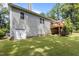 View of the back of the house featuring a deck, backyard and walkout basement at 186 Ross Dr, Pittsboro, NC 27312