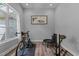Bright flex room with hardwood floors, offering a versatile space for a home office or gym at 186 Ross Dr, Pittsboro, NC 27312