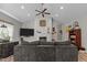 Bright and airy living room with a fireplace, ceiling fan, and plenty of natural light, perfect for relaxation at 186 Ross Dr, Pittsboro, NC 27312