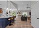 Open-concept living space featuring a large kitchen island, comfortable seating, and modern lighting at 186 Ross Dr, Pittsboro, NC 27312