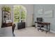 Office space with a large window offering natural light and a calming nature view at 186 Ross Dr, Pittsboro, NC 27312