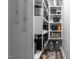 Organized pantry with white shelving and hardwood floors provides ample storage space at 186 Ross Dr, Pittsboro, NC 27312