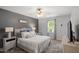 This bedroom offers neutral walls, plush carpet, ceiling fan and natural light at 1990 Ferbow St, Creedmoor, NC 27522