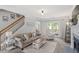 Comfortable living room featuring a fireplace, stairs, and patio access, all in a relaxing setting at 1990 Ferbow St, Creedmoor, NC 27522