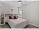 Inviting bedroom with a queen bed, built-in headboard with shelving, and soft gray carpet at 220 W Winmore Ave, Chapel Hill, NC 27516