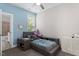 Cheerful bedroom with blue walls, a comfortable bed, and a window for natural light at 220 W Winmore Ave, Chapel Hill, NC 27516