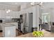 Modern kitchen featuring stainless steel appliances and an island with granite countertops at 220 W Winmore Ave, Chapel Hill, NC 27516