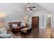 Cozy living area with hardwood floors, ceiling fan, and leather seating with a unique coffee table at 220 W Winmore Ave, Chapel Hill, NC 27516
