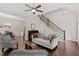 Inviting living room with hardwood floors, view to the dining room, and plenty of space at 220 W Winmore Ave, Chapel Hill, NC 27516