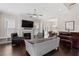 Bright and airy living room with fireplace, hardwood floors, and open floor plan at 220 W Winmore Ave, Chapel Hill, NC 27516