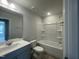 Clean bathroom featuring a tub and shower combo and a neutral color scheme at 231 Paramount Dr, Smithfield, NC 27577