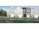 A rendering of new townhomes with covered garages, professional landscaping, and craftsman style elevations at 231 Paramount Dr, Smithfield, NC 27577