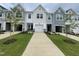 Charming new construction townhomes with attached garages and welcoming front yards at 231 Paramount Dr, Smithfield, NC 27577