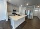 Modern kitchen featuring an island, stainless steel appliances, and ample cabinet space at 231 Paramount Dr, Smithfield, NC 27577